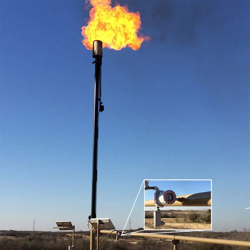 Flare stack against a blue sky